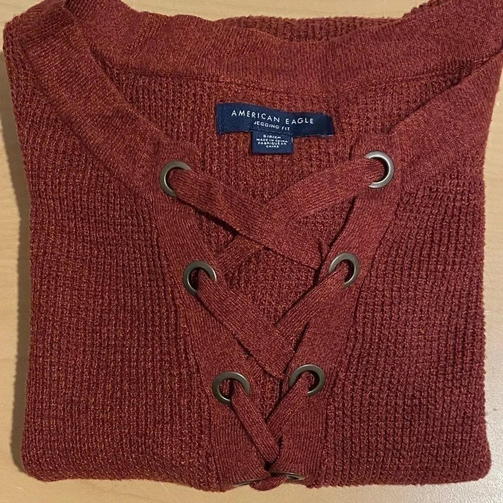 American Eagle size small jegging fit crimson rust color cross tie knit sweater